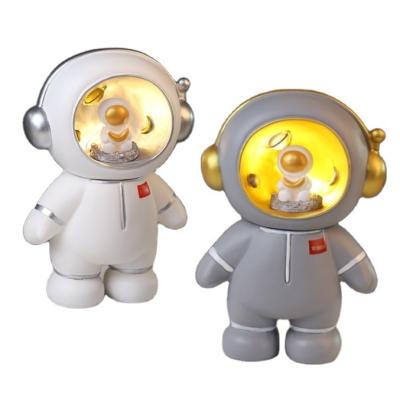 China Customized High Quality Ceramic Astronaut Night Light Projector Cute Piggy Bank for sale