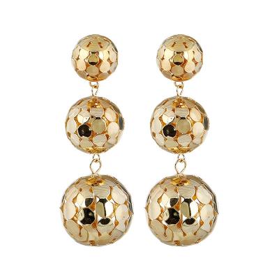 China European and American casual/sports fashion metal color round ball long hollow earrings for sale