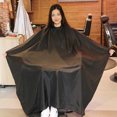 China Waterproof Custom Logo Silicone Neck Barber Cape Salon Hairdressing Cape Hair Cutting Cloth Black for sale