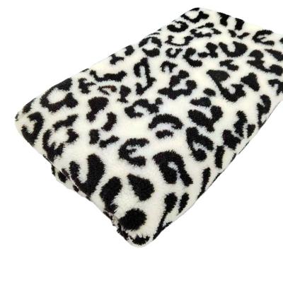 China auto upholstery china factory sale jacquard sherpa fleece lamb berber pile plush faux fur fabrics tops for sale