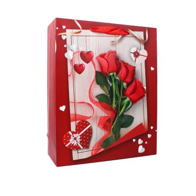 China Logo Printing Luxury Valentine' S Day Three Red Roses Heart Recyclable Pattern Custom Logo Paper Gift Bags With Handles for sale