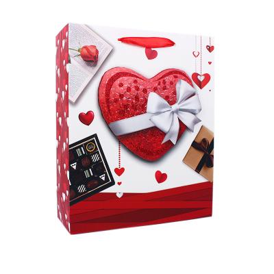 China Wholesale Custom Recyclable Red White Pattern Hearts Valentine's Day Logo Paper Shopping Bags For Gift Bow for sale