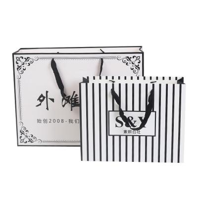 China Recyclable Custom Cosmetic Packaging Jewelry Clothing Packaging White Black Paper Bag Custom for sale