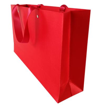 China Customization Printed Red Luxury Shopping Paper Bag Support Durable Shopping Paper Bag With Ribbon Handles for sale