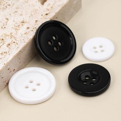 China Four-eye viable button collar cuff shirt factory direct sale wide-rim black and white resin button for sale