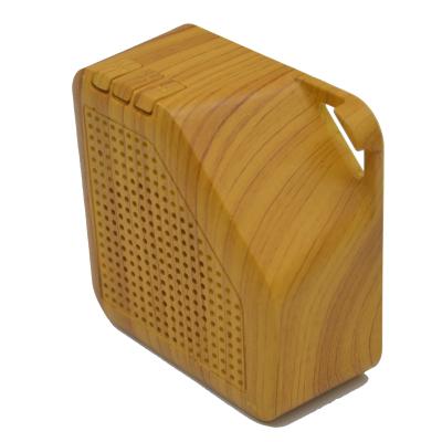 China High quality handheld portable bamboo wooden radio rechargeable battery phone function bamboo speaker and easy to carry for sale