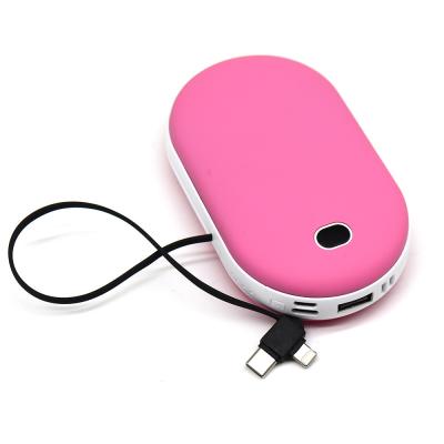 China Portable Winter Mini Hand Warmer 10000mah Wireless Charging Power Bank Built In Cable Phone Charger for sale