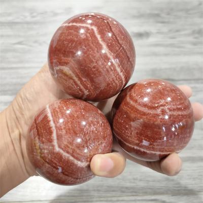 China Wholesale Natural Red Gathered Calcite Crystal Sphere from Europe Crystal Healing Stone Spiritual Ball for sale