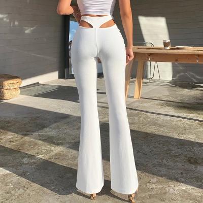 China Carry on KZ-8603 hot new 2021 autumn street pull casual high waist pants micro pants waist hollow pants for sale