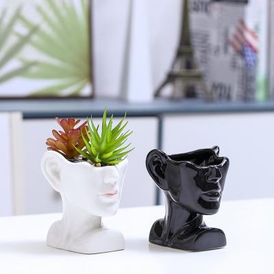 China Nordic creative black and white simple face ceramic simple face small meat flowerpot small meat plant red empty empty flower for sale