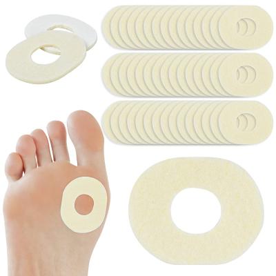 China Foot Pretection 50Pcs Self Stick Oval Soft Felt Corn Pads Hard Protectors For Pain Relief Foot Care for sale