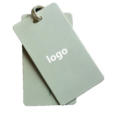 China Anti-Counterfeit Label With Plain Waterproof Custom White PVC Kraft Paper Coated Paper Clothing Tags for sale