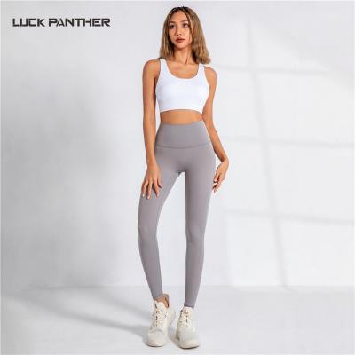 China Quick Dry Sports Gym Girls Unti-peeling High Waist Breathable Nylon Material Women Wearing Printing Leggings Yoga Pants Custom Compression for sale