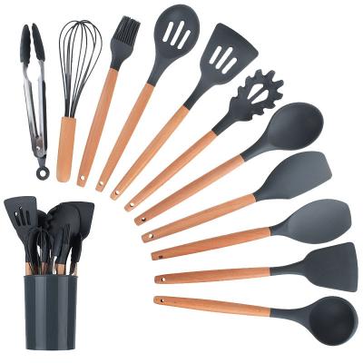 China Sustainable Hot Selling 12pcs Food Grade Silicone Kitchen Wooden Cookware Set With Stand for sale