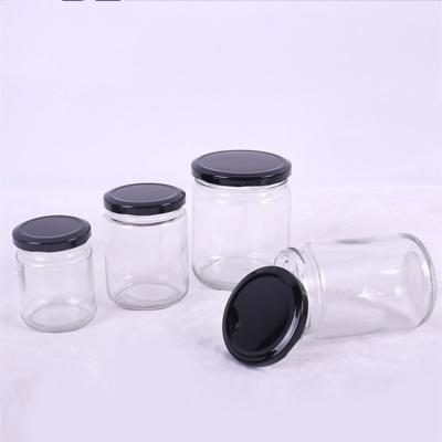 China Food Honey Sauce Jam Storage Clear Jars Glass Bottles With Caps for sale