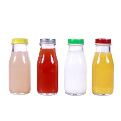 China Custom cold tea kombucha daily life infusions fresh fruit juice glass drinking bottle with lid for sale