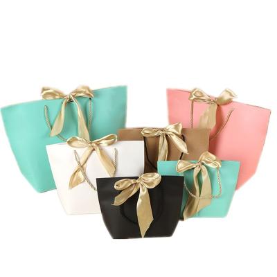 China Recycled Materials Customized Recycled Colorful Cardboard Goodie Packaging Craft Paper Bag With Handle Paper Bags Pink for sale