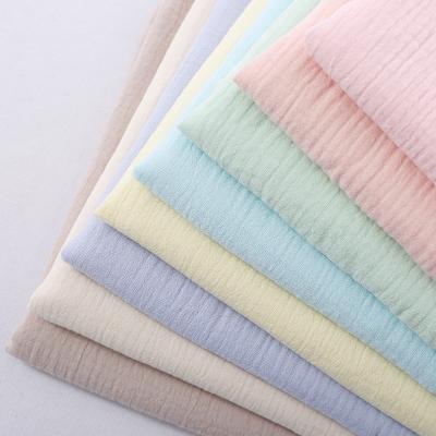 China Anti-Static Wholesale organic 100% cotton solid color muslin fabric soft double gauze muslin fabric for cloth for sale