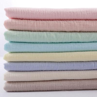 China Anti-Static Wholesale organic 100% cotton double gauze muslin fabric solid color muslin fabric for baby blanket for sale