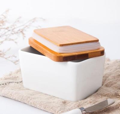 China Ceramic Rectangle Kitchen Household Stocked Wholesale White Butter Dish With Wooden Lip Knife for sale