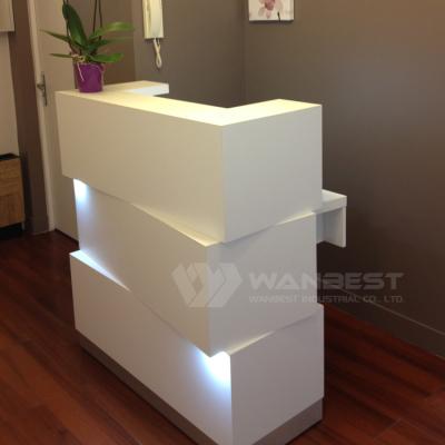 China Cheap Artificial Stone Convertible Led Small Modular Front Desk Beauty Salon Spa Reception Table for sale