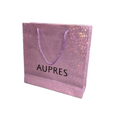 China Custom Recyclable Shiny Paper Bag Clothing Store DF Logo Laser Paper Bag Makeup Gift Bag Shopping Packaging Bag for sale