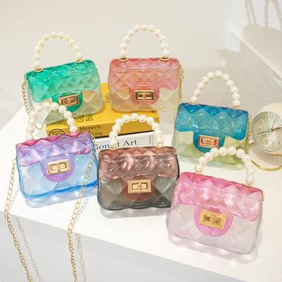 China Fashion Wholesale New Design Transparent Pearl One-shoulder Color Matching Mini Messenger With Lock Jelly Bag for sale