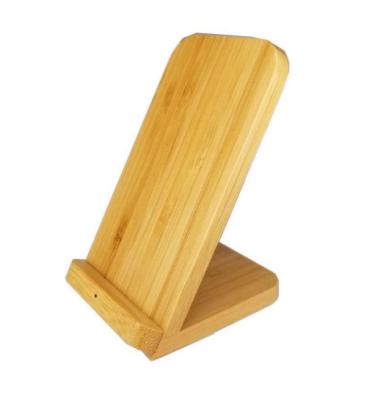 China Mobile phone dual coil wireless charger for 1 device in bamboo casing and with stand functionality. Place the smartphone on it to start charging for sale