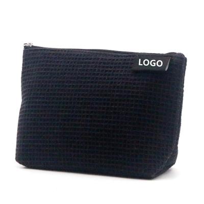 China Eco-friendly Normcore / Minimalist 2022 Black Recycled Polyester rPET Makeup Bag Unique Waffle Pattern Sustainable Cosmetic Bag for sale