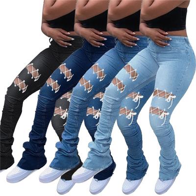 China 2022 New Design Women Denim Jeans Womens Hollow Out Pants Women Street Wear Fashion Bandage Breathable Stacked Pants for sale