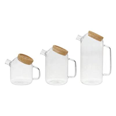 China Viable Creative Heat Resistant Cold Kettle Juice Drink Cup Cork Borosilicate Glass Cover Jug Cup Transparent for sale