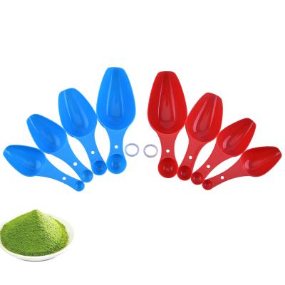 China Sustainable Red Plastic Shovel Shape 4 Pcs Power And Liquid Doser Set for sale