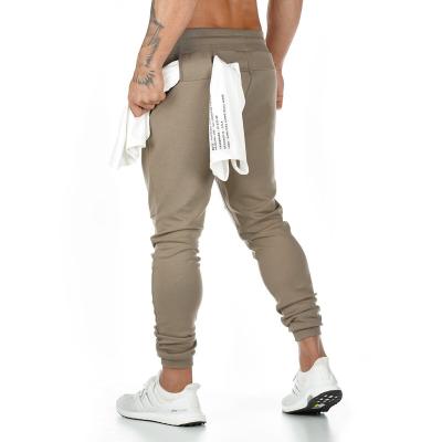 China Breathable Daily Wear Casual Pants Men Training Pants Sustainable Pants for sale