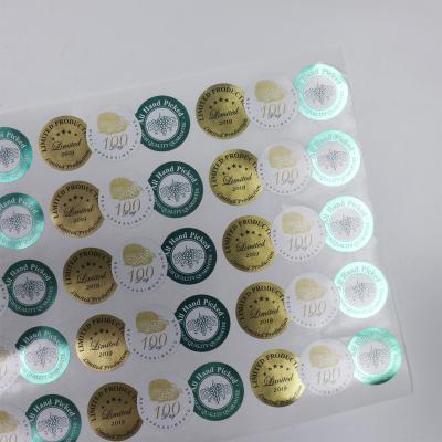 China Shinny Waterproof Laser Self Adhesive Logo Printing Waterproof Roll Labels Factory Price Custom Clear Gold Foil Private Sticker for sale