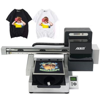 China Hotels DTF T-shirt printer with original xp600 main two heat transfer film printer with dusting machine for sale