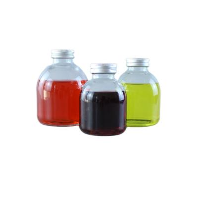 China Wholesale Food Grade Beverage Juice Beverage Bottle Water Short Cute Glass Milk Juice Beverage Glass Bottle With Lid for sale