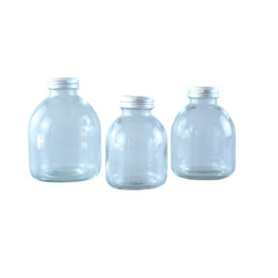 China 50ml 100ml Empty Transparent Round Beverage Juice Bottle Glass Beverage Bottle Juice Drinks Container With Lid for sale