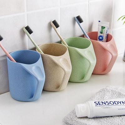 China Viable Wheat Straw Mugs Biodegradable Plastic Cups Gargle Cup With Handle With Toothbrush Holder Hole Mouth Sloping Upside Down Cup for sale