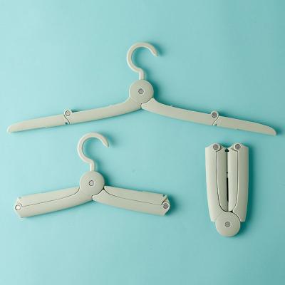 China Foldable Multi-Function Kids Hanger Travel Baby Folding Non Slip Clothes Drying Coat Hanger Traditional Plastic Rack Hanger for sale