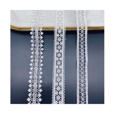 China Sustainable Wholesale Clothes Decoration Ribbon White Silver Fabric Lace Trim for sale