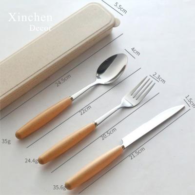 China Viable Hot Selling Wooden Handle Stainless Steel Knife Fork Spoon Cutlery Set for sale