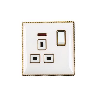 China UK standard high quality white color and gold frame 13A switched socket with neon wall switch for sale