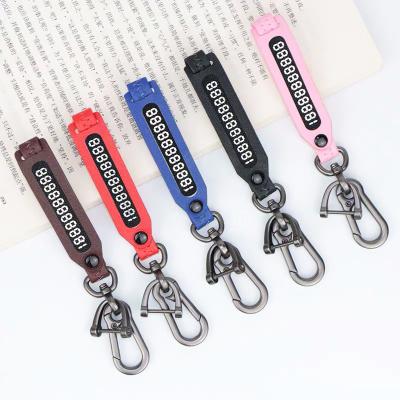 China Anti-lost Car Key Chain Metal Phone Number Dish Car Key Chain Pendant Leather Braided Key Chain Number Card Key Holder for sale