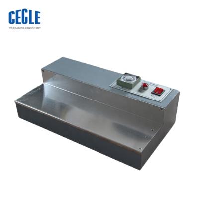 China CW-115 Manual CLOTHING Perfume Box Cellophane Packing Machine for sale