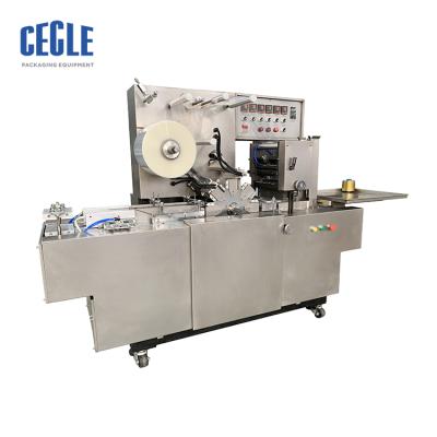 China CW-200 Chemical Automatic Cellophane Wrapping Machine and Perfume Box Automatic Overwrapping Machine for sale