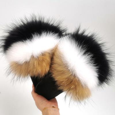 China Fashion Trend Women's Soft Fox Fur Slippers Large Slips Hairy Extra Fluffy Raccoon Fur Sandals Women Women for sale