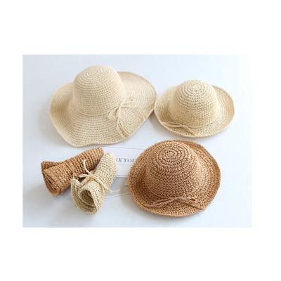 China Mother and Daughter Dobby Baby Summer Sun Umbrella Beach Travel Folding Straw Hat for sale