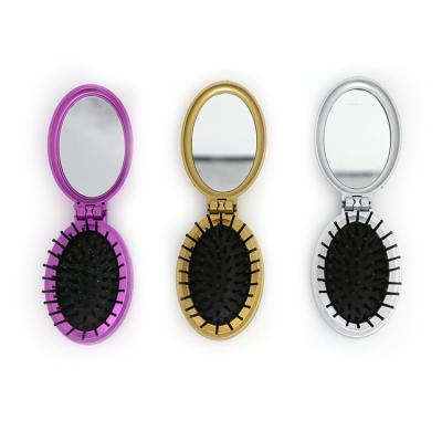 China Custom Automatic Folding Detangling Pocket Hair Brush Waterproof Mini Pocket Hair Comb With Mirror for sale