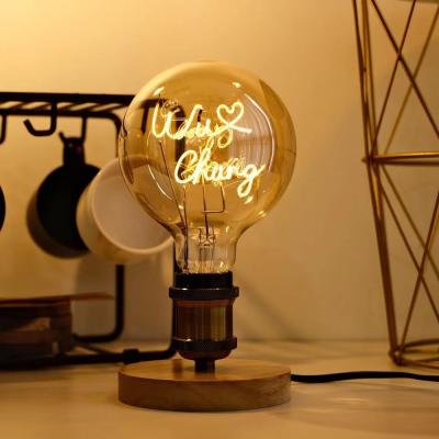 China Hotel LED Filament Bulb 4W G125 Series Dimmable Glass Clear Amber Base Edison Light Bulb for sale