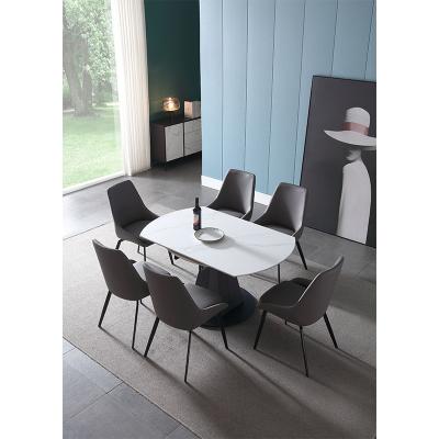 China Modern Extendable Furniture Chipboard Stone Dining Table Sets With 6 Chairs Black Carbon Steel Foldable Extendable Dining Table for sale